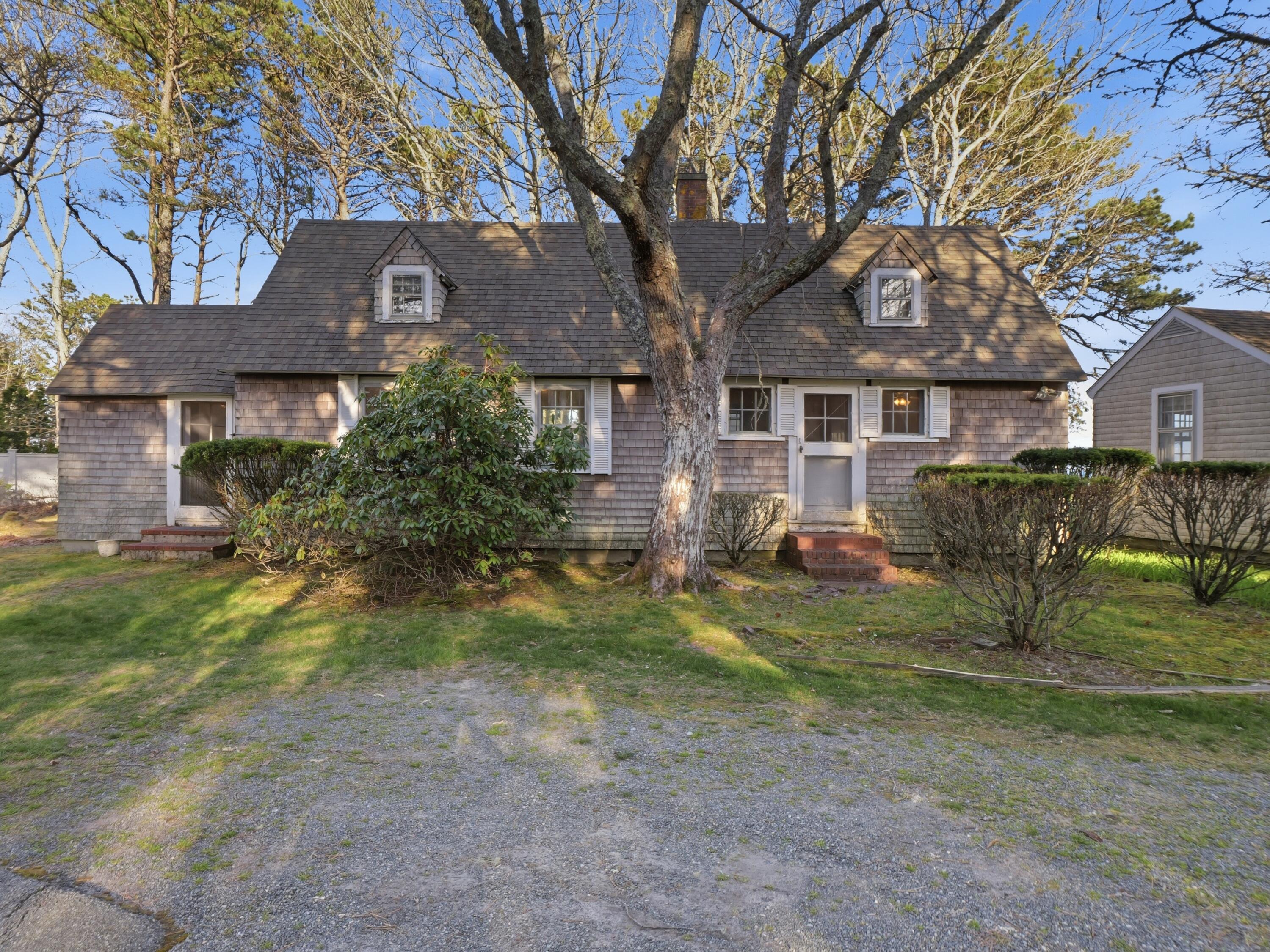 190 Vineyard Road Cotuit, MA 02635 - Photo 30 of 41 a front view of a house with garden