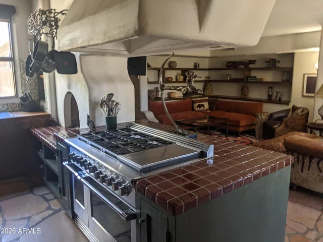 a view of a dining room with furniture and a fireplace
