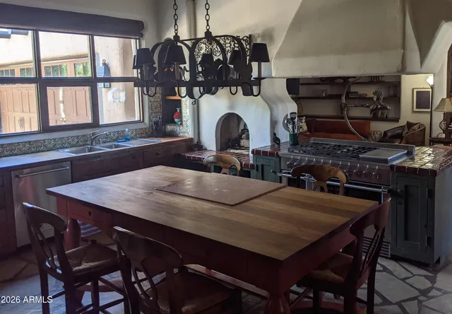 a bedroom with a bed and painting on the wall