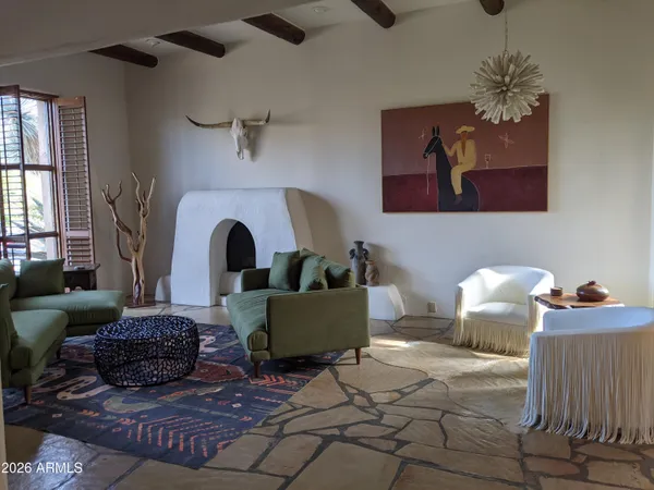 a view of a dining room with furniture and a chandelier