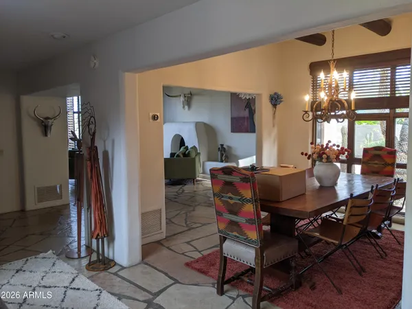 a bed room with a bed and a tv on table