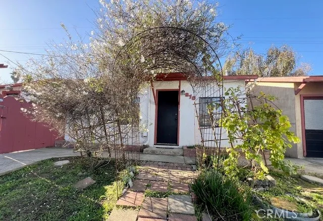 a front view of a house with garden