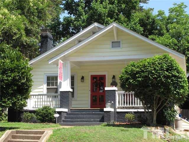2221 The Circle Raleigh, NC 27608 - Photo 1 of 15 a front view of a house with a yard