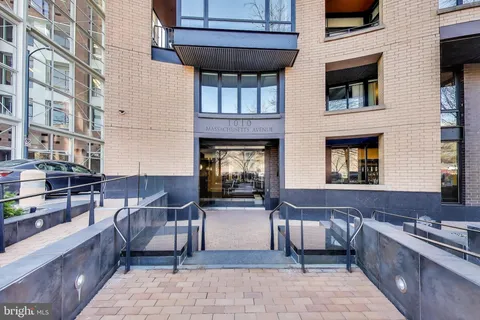 a view of a brick building with many windows