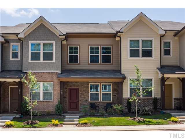 707 Wickham Ridge Road, Unit 160 Apex, NC 27539 - Photo 1 of 21 a front view of a house with garden