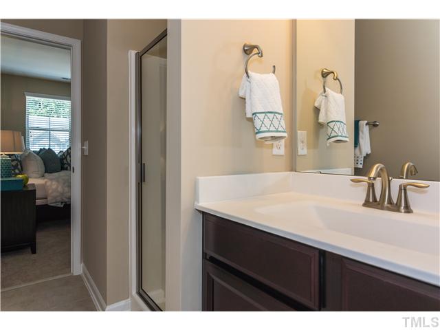 707 Wickham Ridge Road, Unit 160 Apex, NC 27539 - Photo 15 of 21 a en suite bathroom with a sink and a mirror