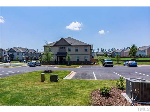 707 Wickham Ridge Road, Unit 160 Apex, NC 27539 - Photo 19 of 21 a swimming pool with outdoor seating and yard