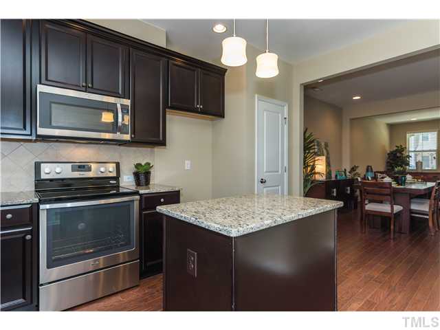 707 Wickham Ridge Road, Unit 160 Apex, NC 27539 - Photo 8 of 21 a kitchen with a stove microwave and sink