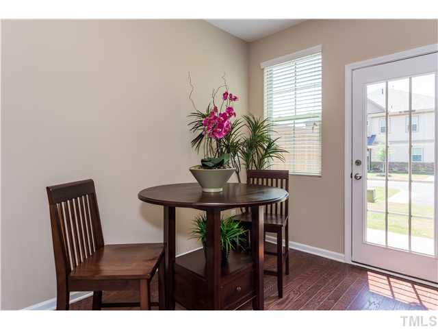 707 Wickham Ridge Road, Unit 160 Apex, NC 27539 - Photo 10 of 21 a dining room with furniture and window