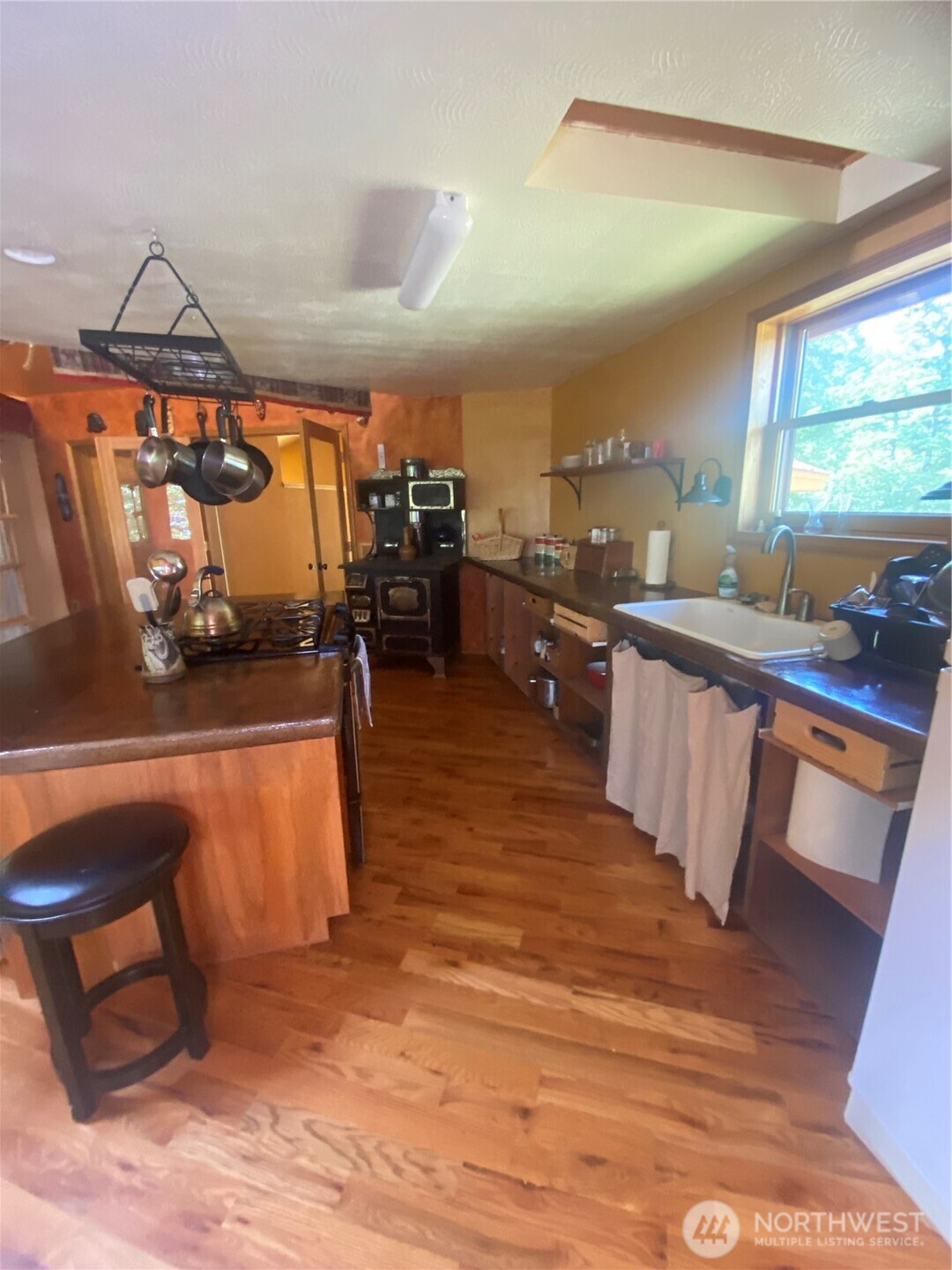 0 Big Springs Ranch Road Wenatchee, WA 98801 - Photo 17 of 26 a kitchen with stainless steel appliances wooden floor dining table chairs and granite counter tops