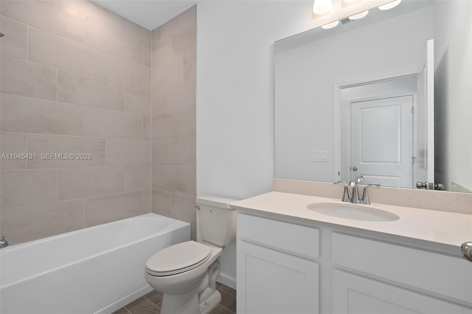 8934 Southwest 69th Terrace Ocala, FL 34476 - Photo 12 of 41 a bathroom with a sink a toilet and a bathtub
