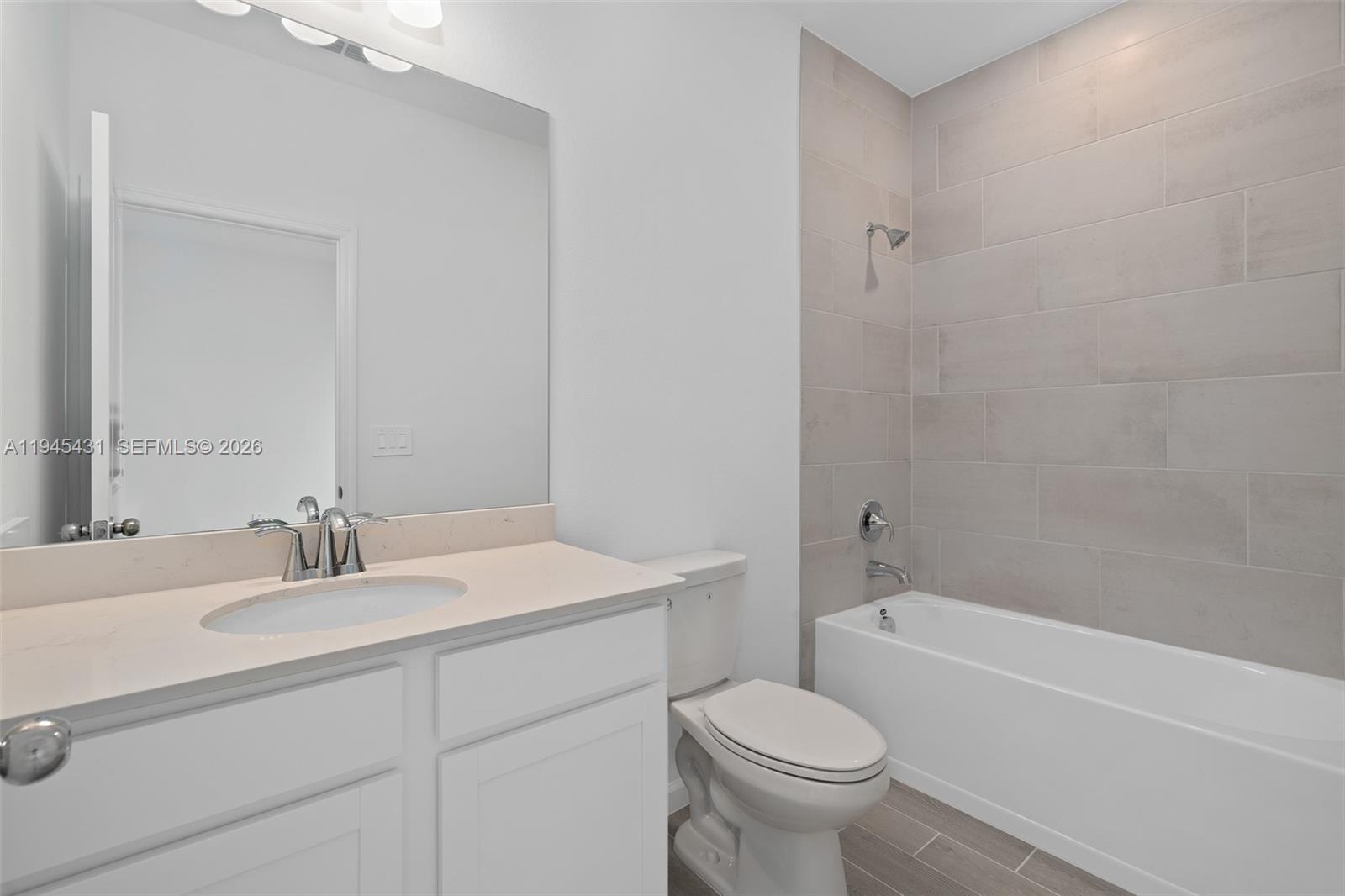 8934 Southwest 69th Terrace Ocala, FL 34476 - Photo 17 of 41 a bathroom with a sink toilet and a bathtub
