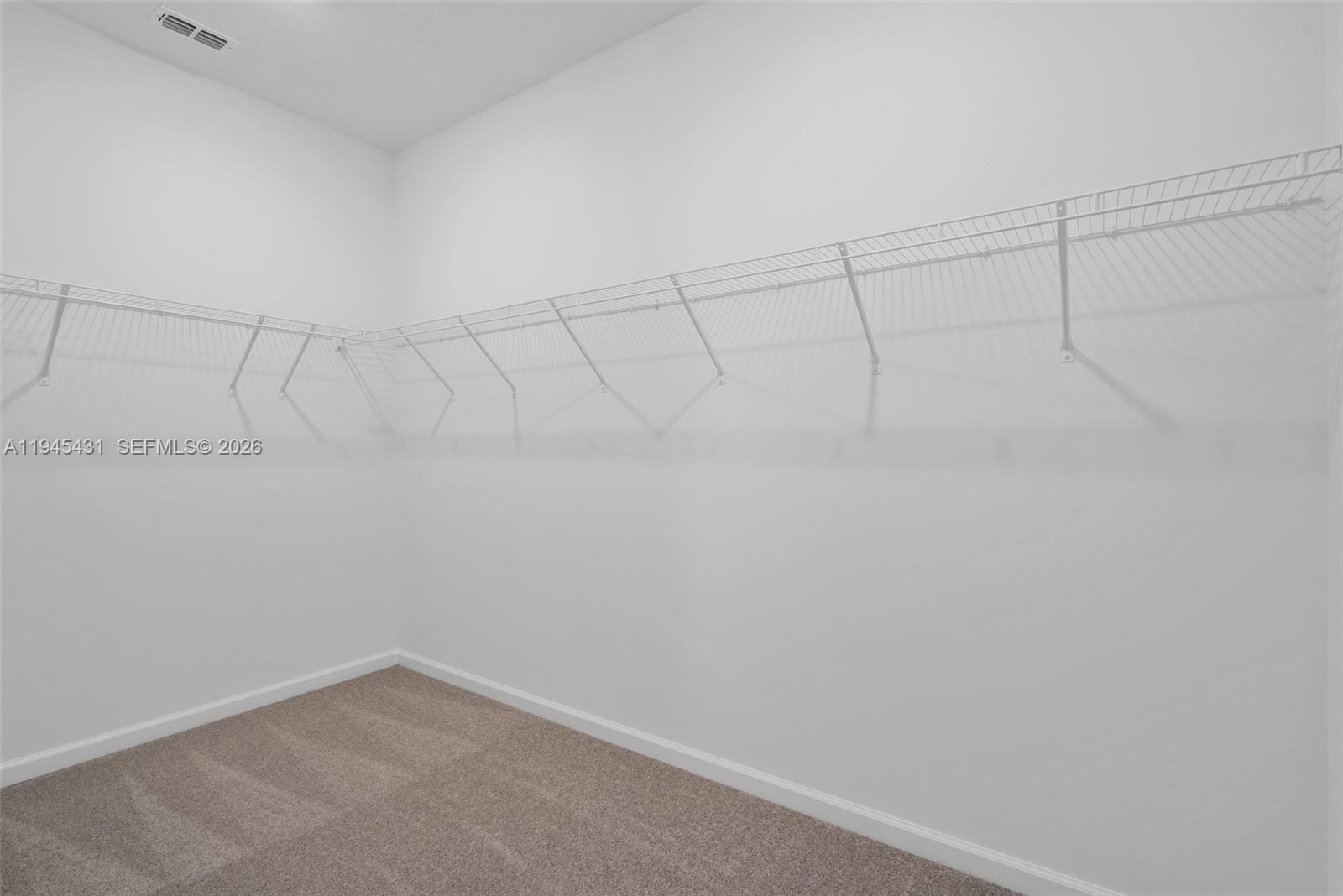 8934 Southwest 69th Terrace Ocala, FL 34476 - Photo 21 of 41 a view of a room with racks on the wall