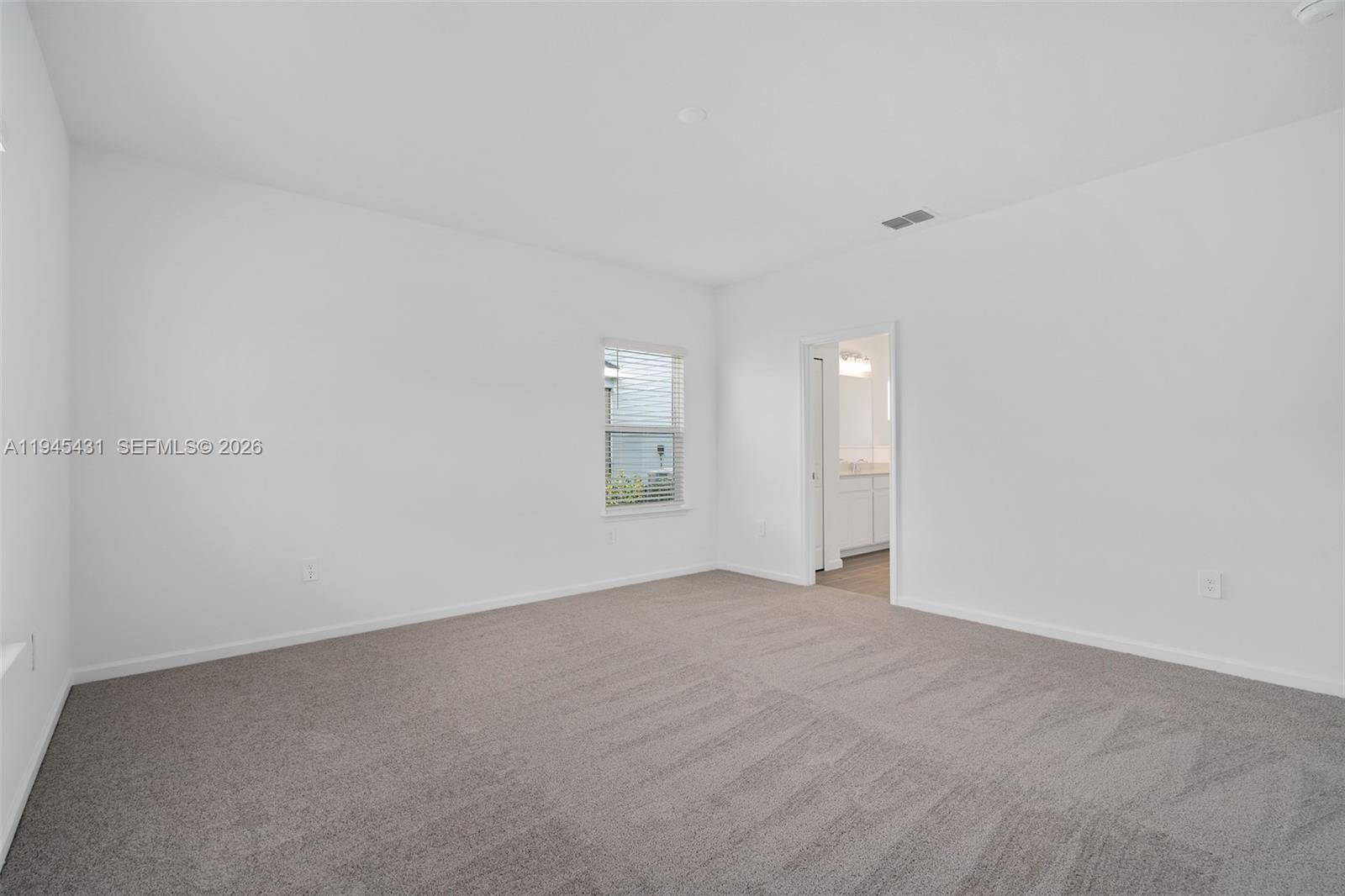 8934 Southwest 69th Terrace Ocala, FL 34476 - Photo 22 of 41 a view of an empty room with window