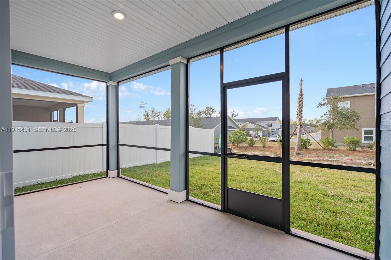 8934 Southwest 69th Terrace Ocala, FL 34476 - Photo 26 of 41 a view of an empty room with a floor to ceiling window