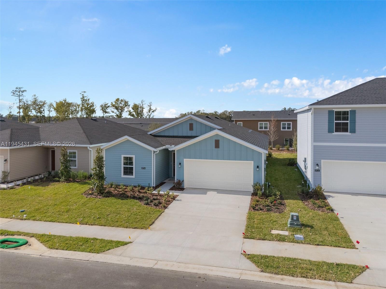 8934 Southwest 69th Terrace Ocala, FL 34476 - Photo 31 of 41 a front view of a house with a yard