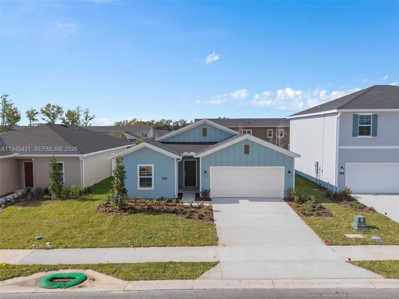 8934 Southwest 69th Terrace Ocala, FL 34476 - Photo 32 of 41 a front view of a house with a yard