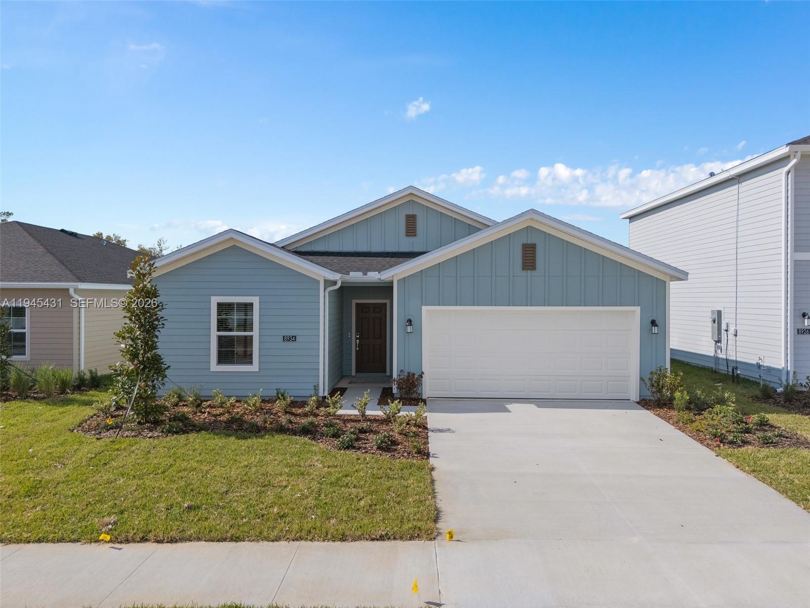 8934 Southwest 69th Terrace Ocala, FL 34476 - Photo 34 of 41 a front view of house with yard