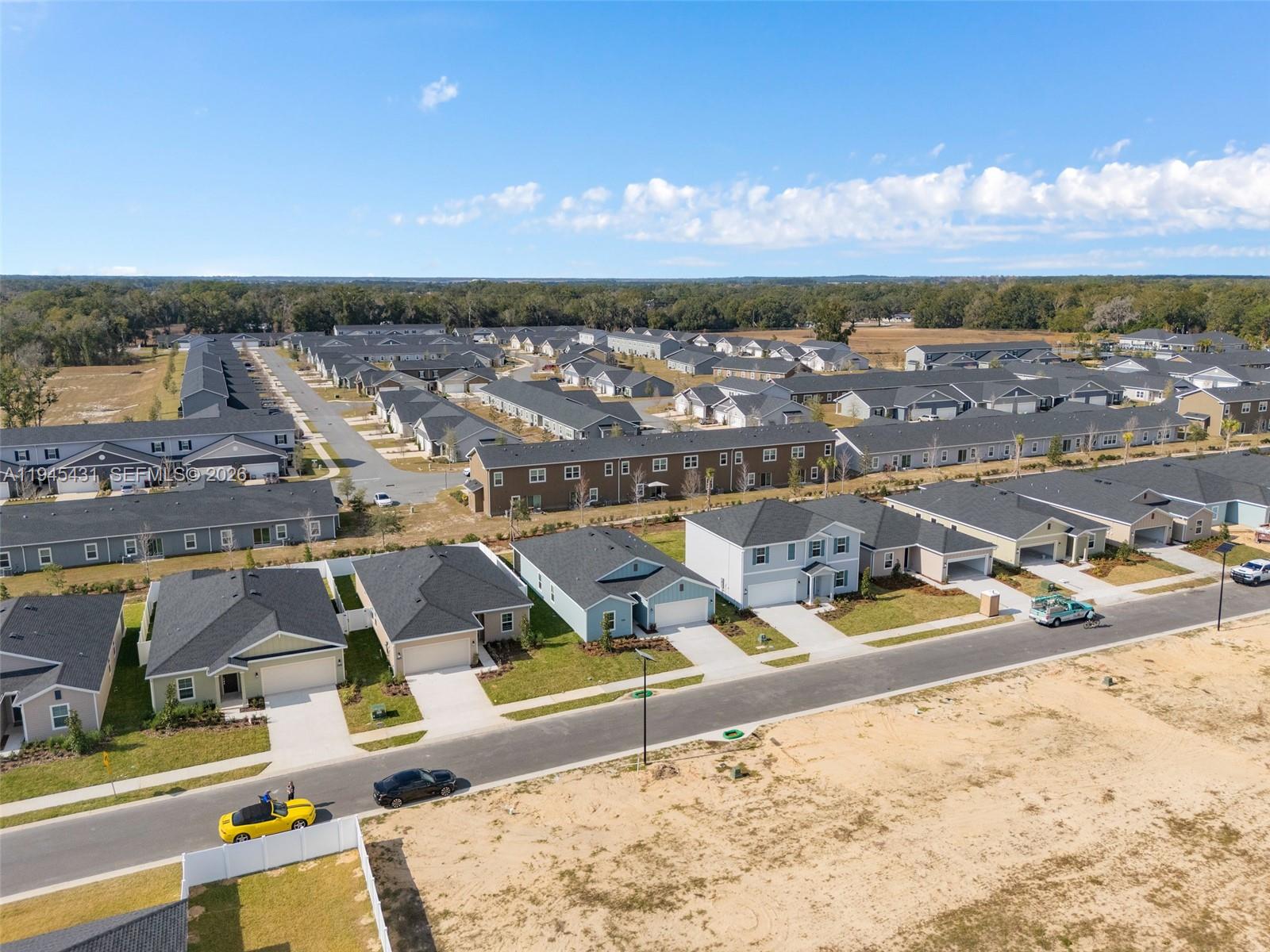 8934 Southwest 69th Terrace Ocala, FL 34476 - Photo 36 of 41 an aerial view of residential houses with outdoor space
