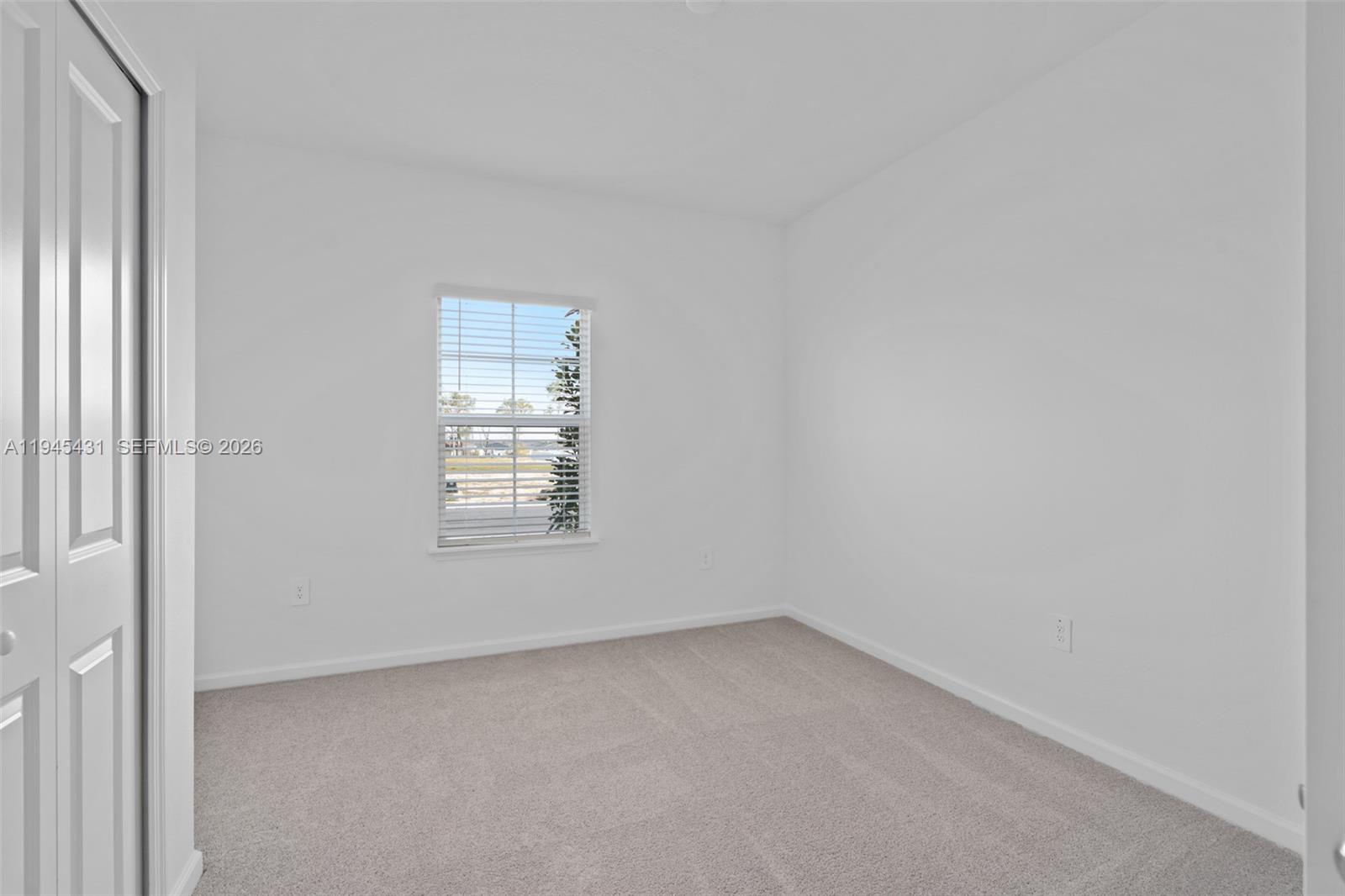 8934 Southwest 69th Terrace Ocala, FL 34476 - Photo 10 of 41 an empty room with a window