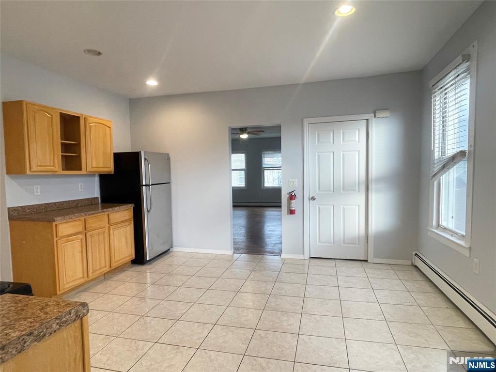82-84 Maple Avenue, Unit 2 Wallington, NJ 07057 - Photo 3 of 11 a view of a refrigerator in kitchen and a sink