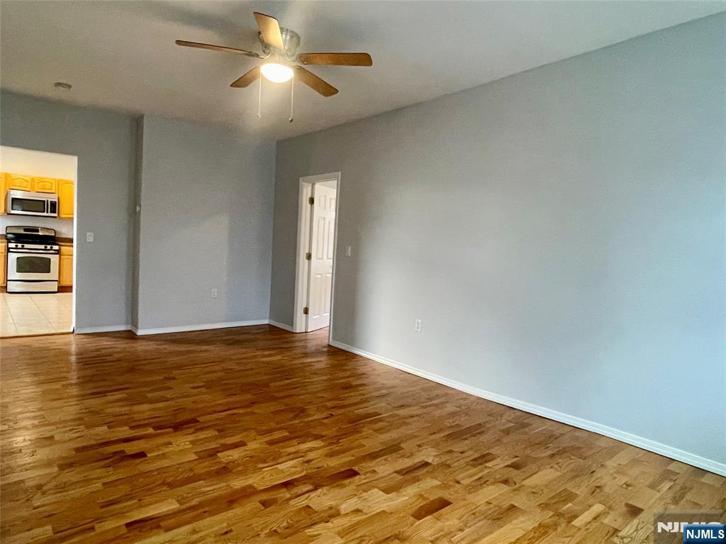 82-84 Maple Avenue, Unit 2 Wallington, NJ 07057 - Photo 5 of 12 a view of empty room with wooden floor