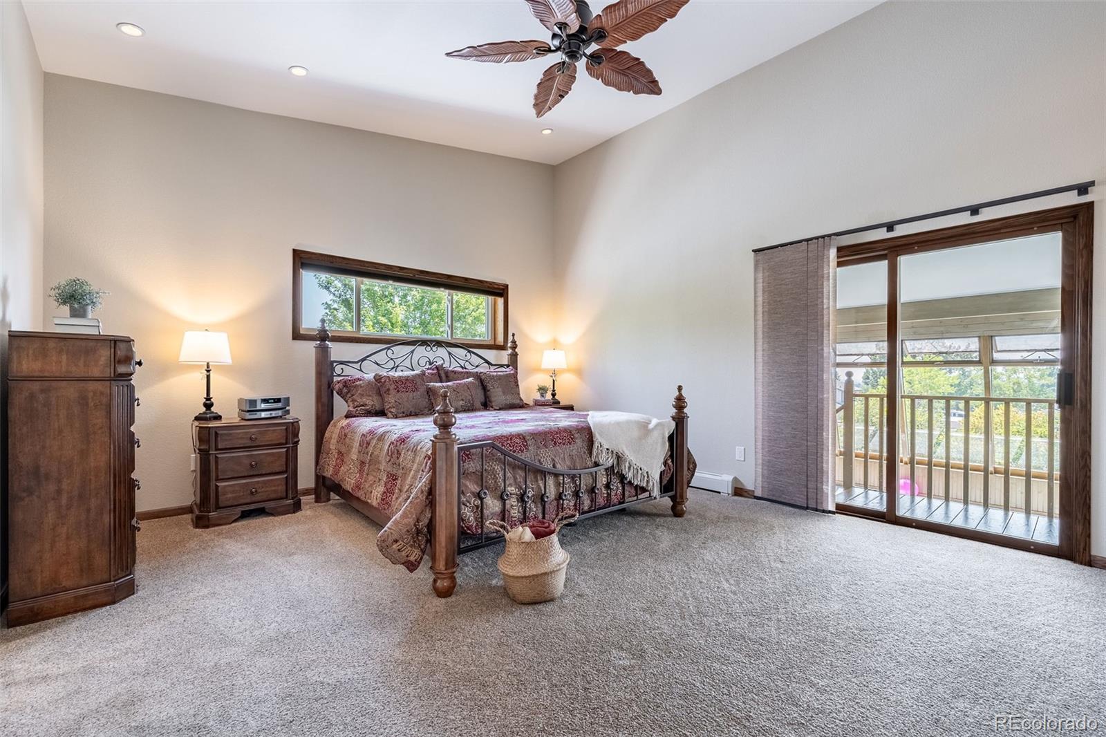 16609 West 77th Drive Arvada, CO 80007 - Photo 12 of 48 a bed sitting in a room next to a window