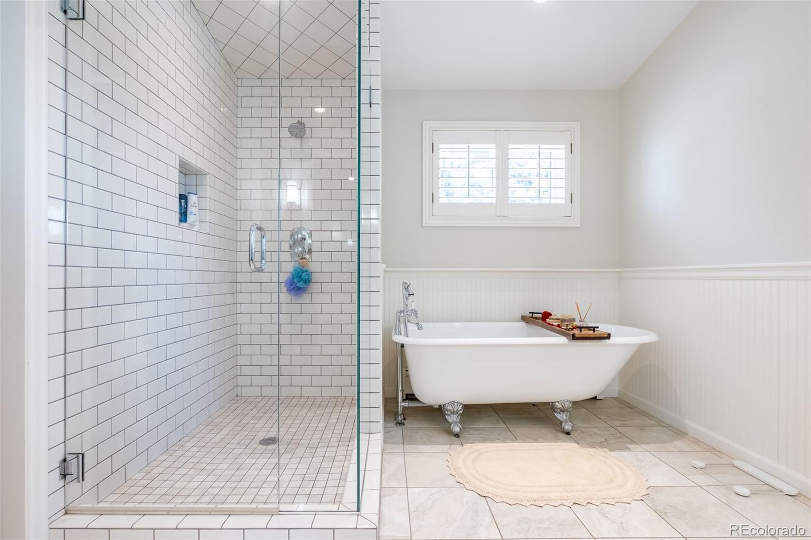 16609 West 77th Drive Arvada, CO 80007 - Photo 14 of 48 a bathroom with a sink a toilet and shower