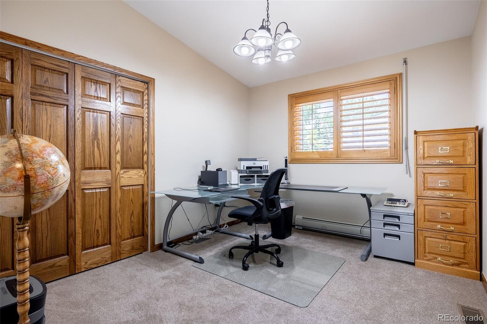 16609 West 77th Drive Arvada, CO 80007 - Photo 20 of 48 a view of a workspace with furniture and a window