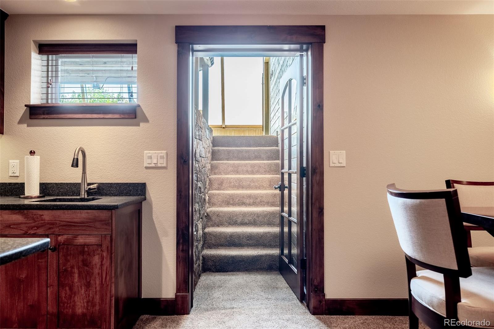 16609 West 77th Drive Arvada, CO 80007 - Photo 29 of 48 a view of a hallway with seating area