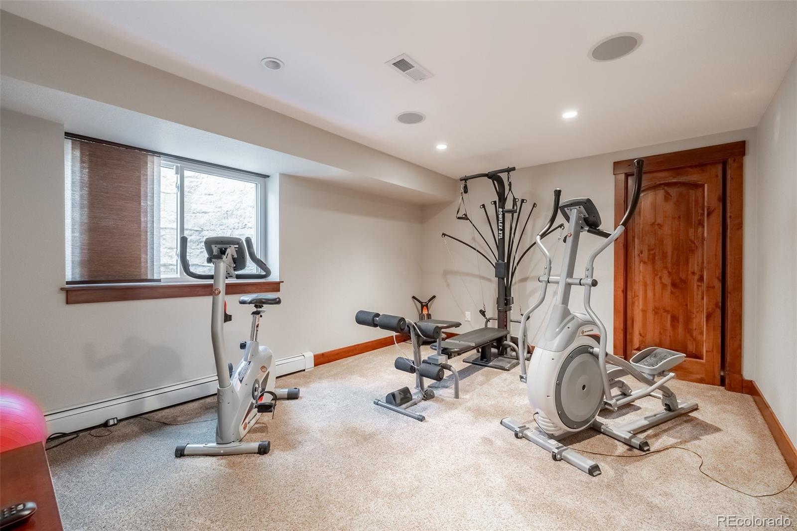 16609 West 77th Drive Arvada, CO 80007 - Photo 30 of 48 a view of a room with gym equipment