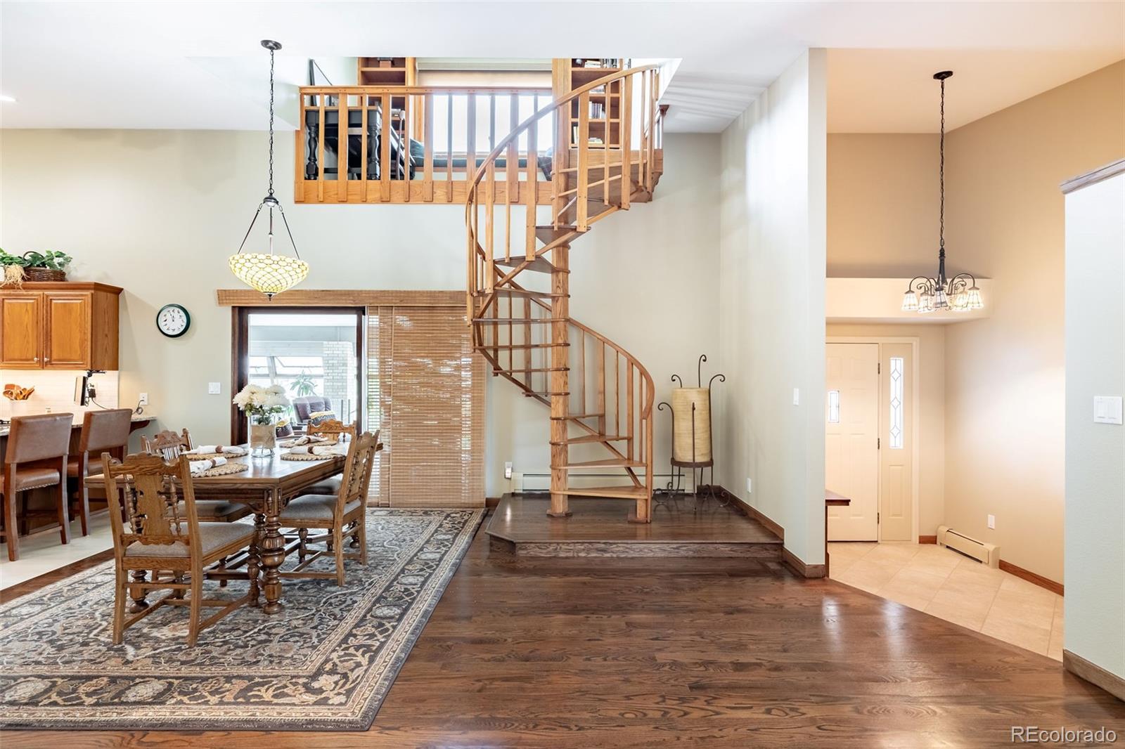 16609 West 77th Drive Arvada, CO 80007 - Photo 3 of 48 a view of a living room and dining room