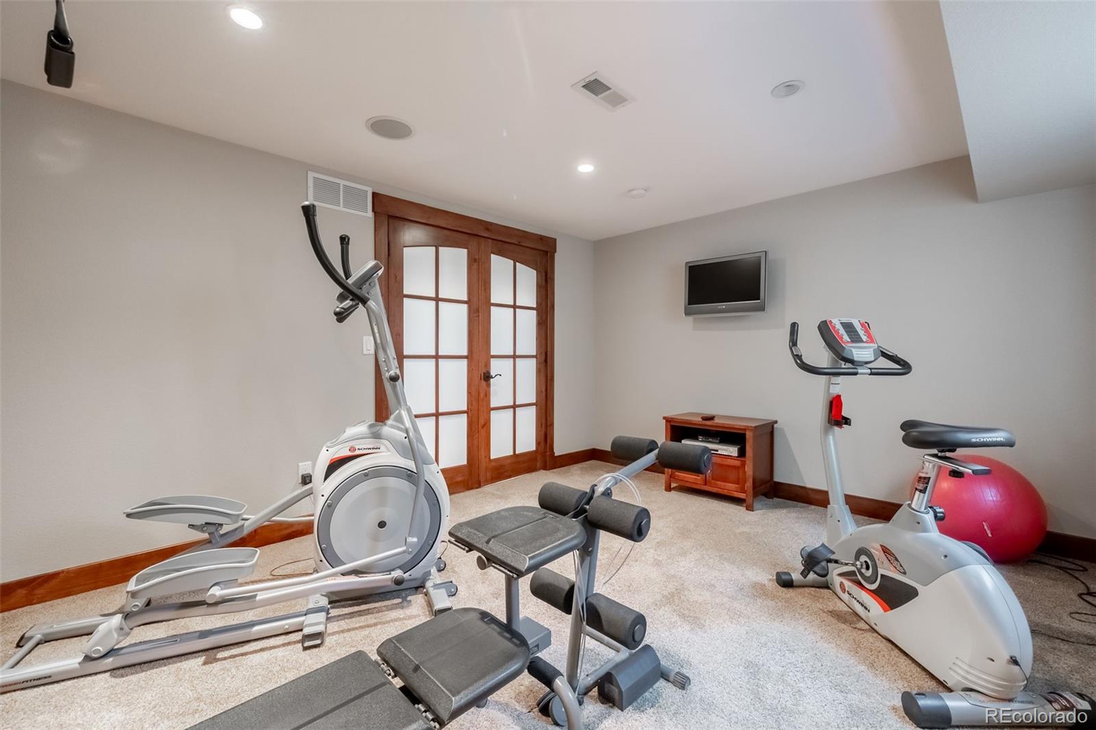 16609 West 77th Drive Arvada, CO 80007 - Photo 31 of 48 a room with gym equipment and a window