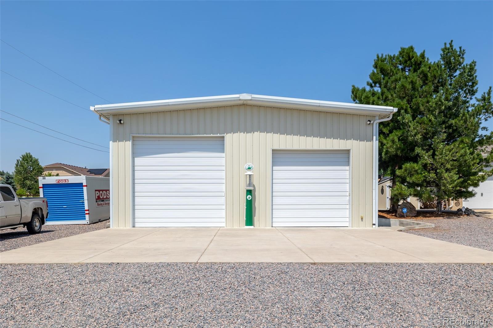 16609 West 77th Drive Arvada, CO 80007 - Photo 40 of 48 a front view of a house with a yard and garage
