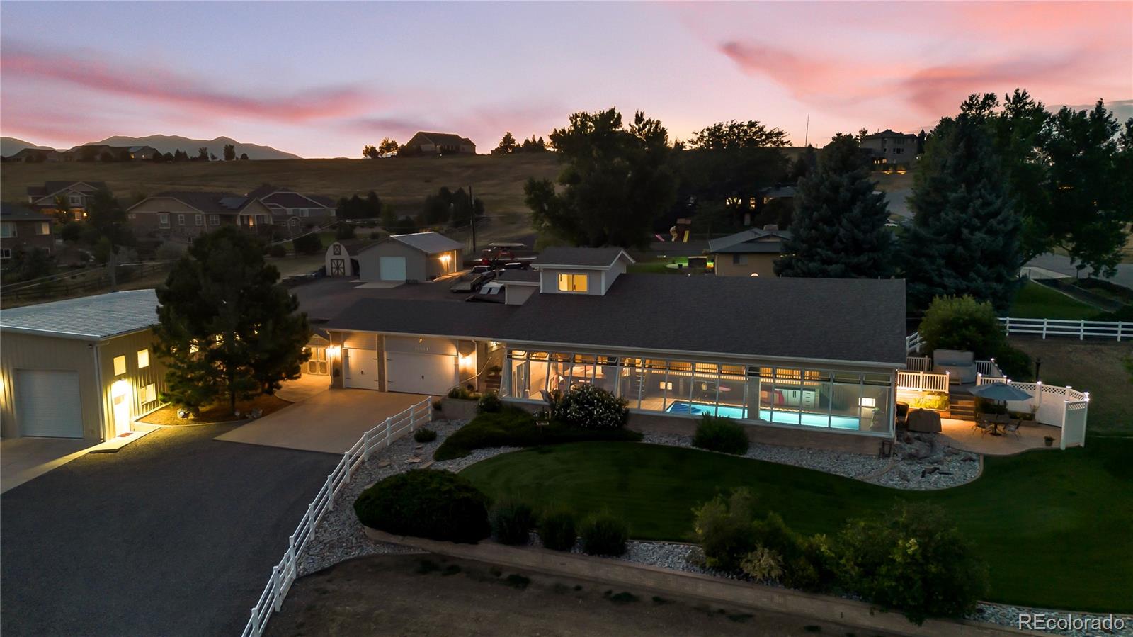 16609 West 77th Drive Arvada, CO 80007 - Photo 47 of 48 a view of a fountain in front of a house with a yard