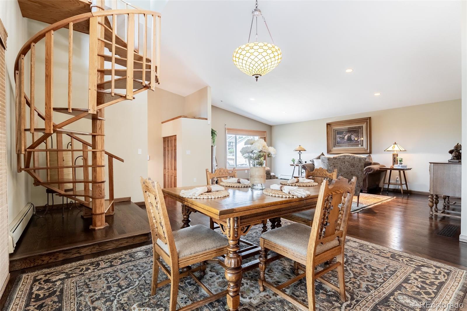16609 West 77th Drive Arvada, CO 80007 - Photo 7 of 48 a view of a dining room with furniture