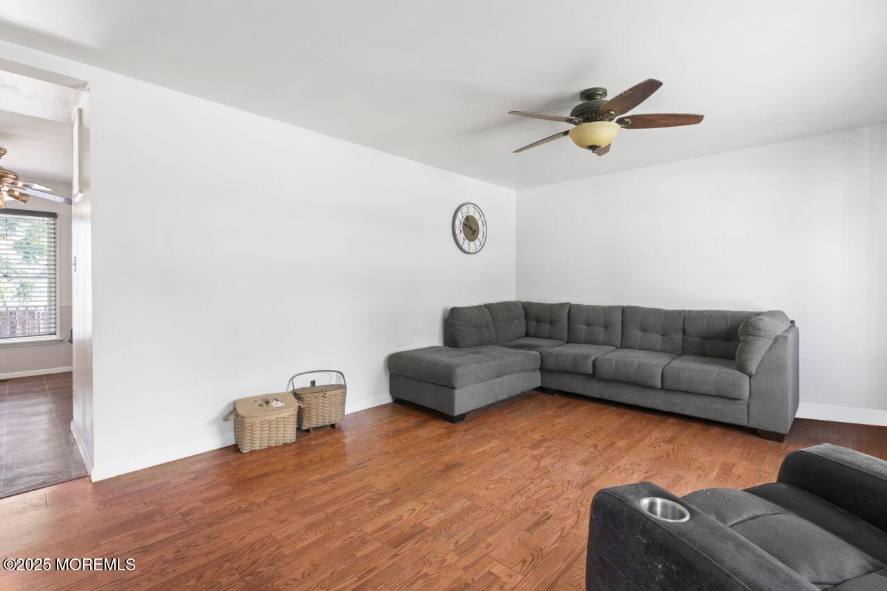 45 Letts Landing Road Waretown, NJ 08758 - Photo 11 of 28 a living room with furniture and a wooden floor