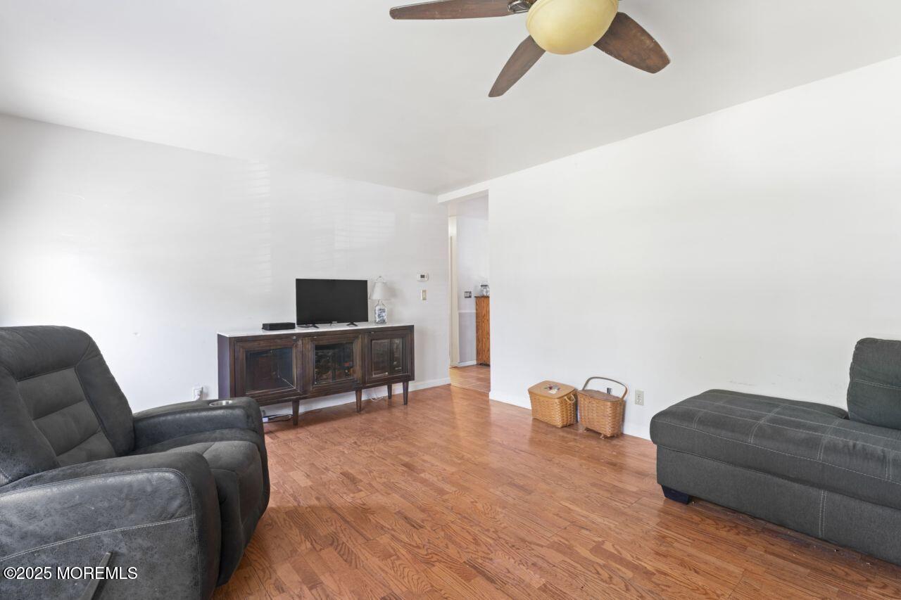 45 Letts Landing Road Waretown, NJ 08758 - Photo 13 of 28 a living room with furniture and a couch