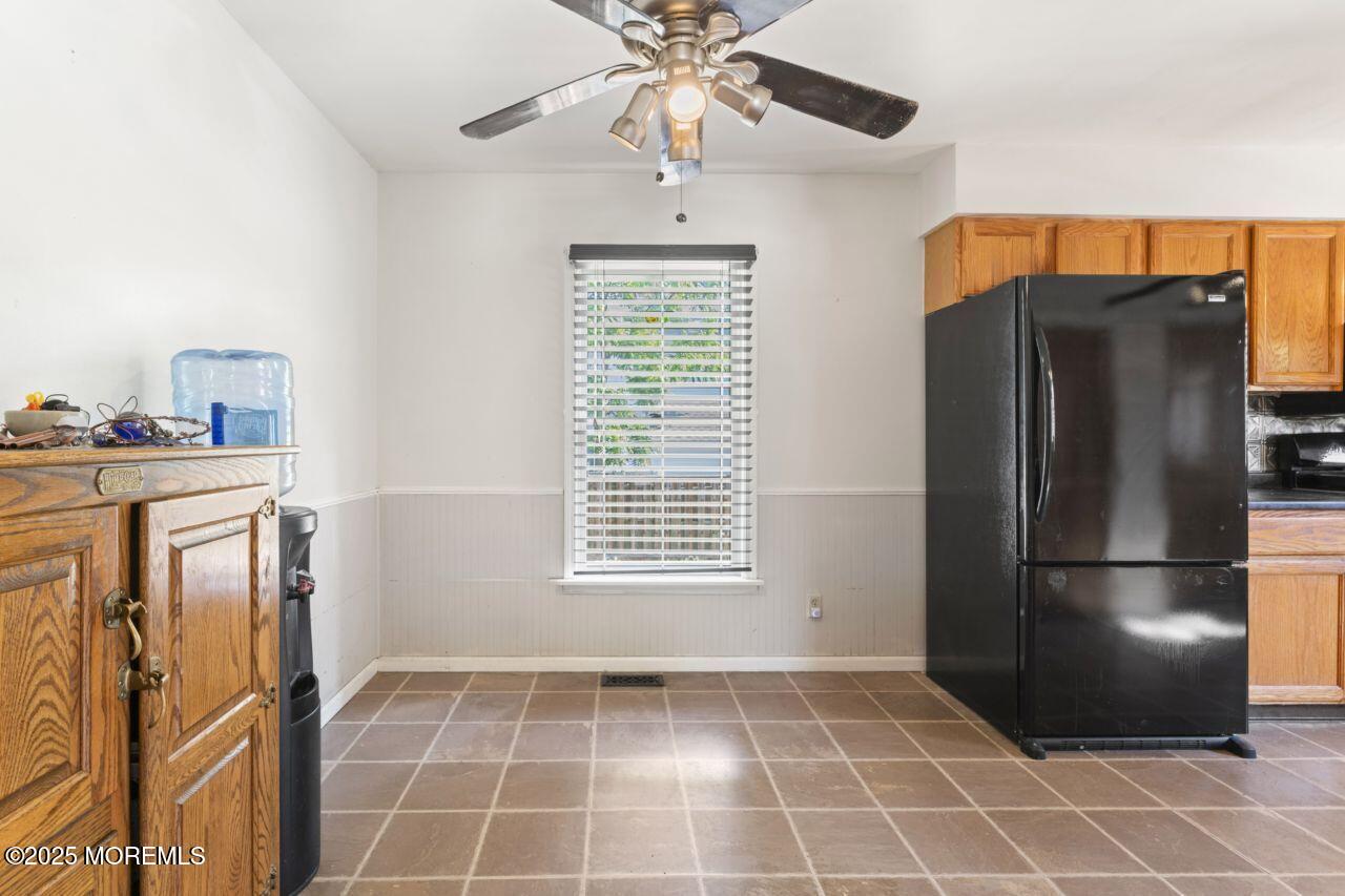 45 Letts Landing Road Waretown, NJ 08758 - Photo 14 of 28 a kitchen with stainless steel appliances a refrigerator and a chandelier