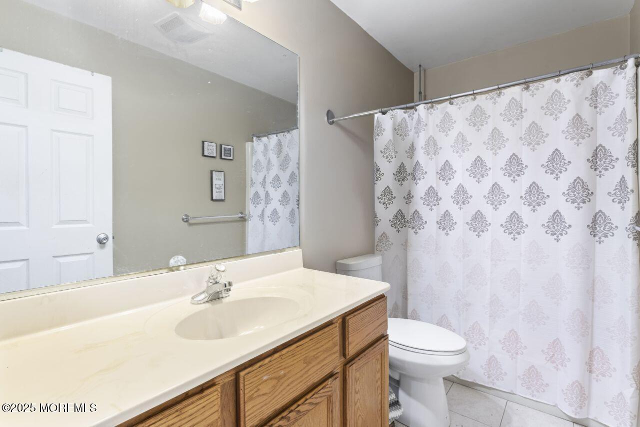 45 Letts Landing Road Waretown, NJ 08758 - Photo 21 of 28 a bathroom with a sink toilet and shower