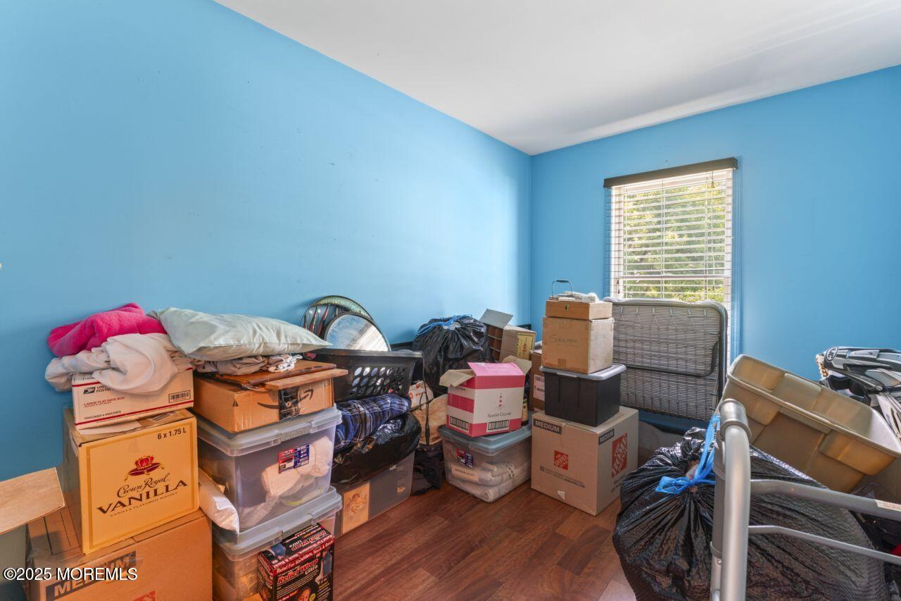 45 Letts Landing Road Waretown, NJ 08758 - Photo 22 of 28 a workspace with furniture and wooden floor
