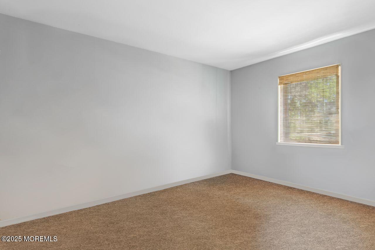 45 Letts Landing Road Waretown, NJ 08758 - Photo 26 of 28 an empty room with a window