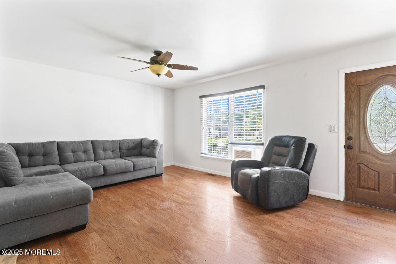 45 Letts Landing Road Waretown, NJ 08758 - Photo 9 of 28 a living room with furniture and a window
