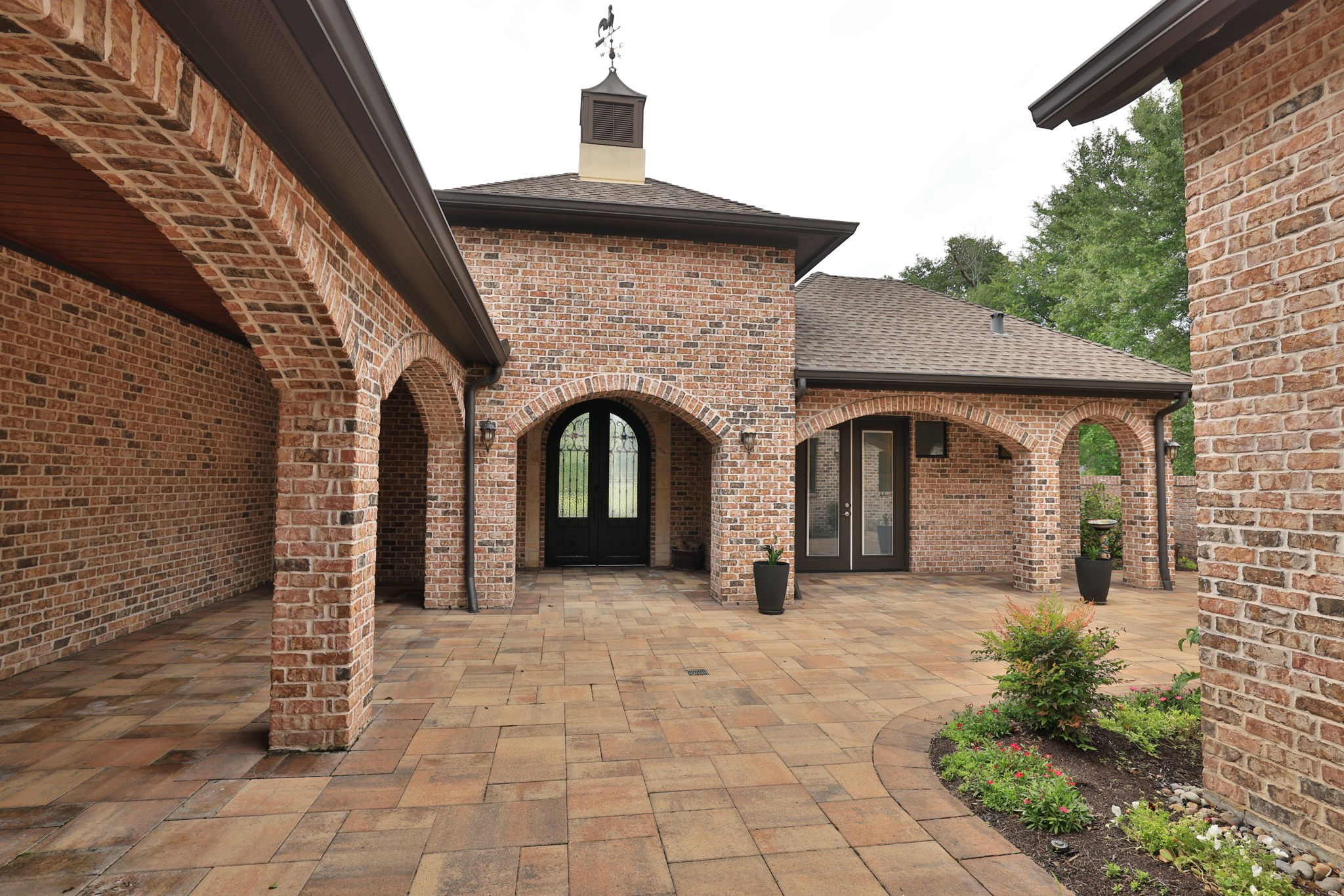 6918 Comanche Bend Montgomery, TX 77316 - Photo 11 of 50 This home is an entertainer’s dream with so many beautiful spaces to gather and enjoy. The double doors to the right provide private entry into the casita, offering wonderful flexibility for guests, extended family, a home office, or private retreat space.