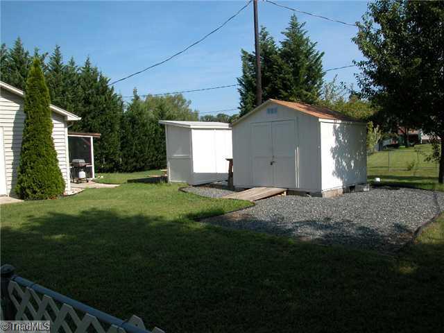 Outbuilding. Two storage buildings w/gravel parking for your boat.