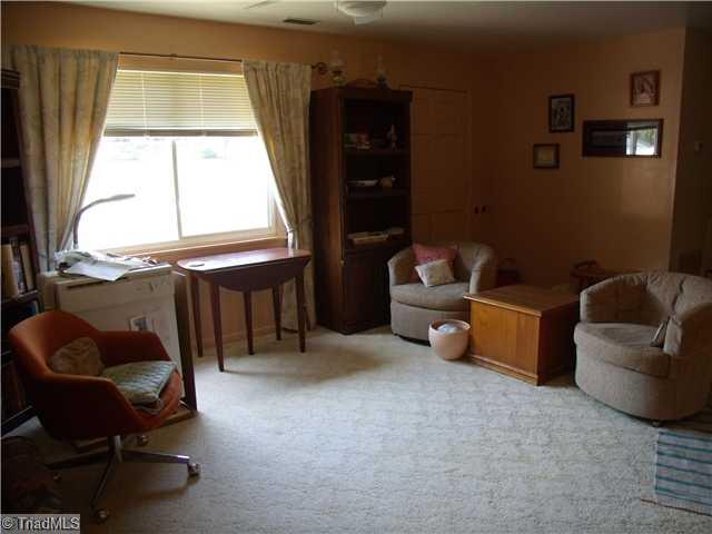 Living Room. Tiled entry floor w/carpeted formal living room area.