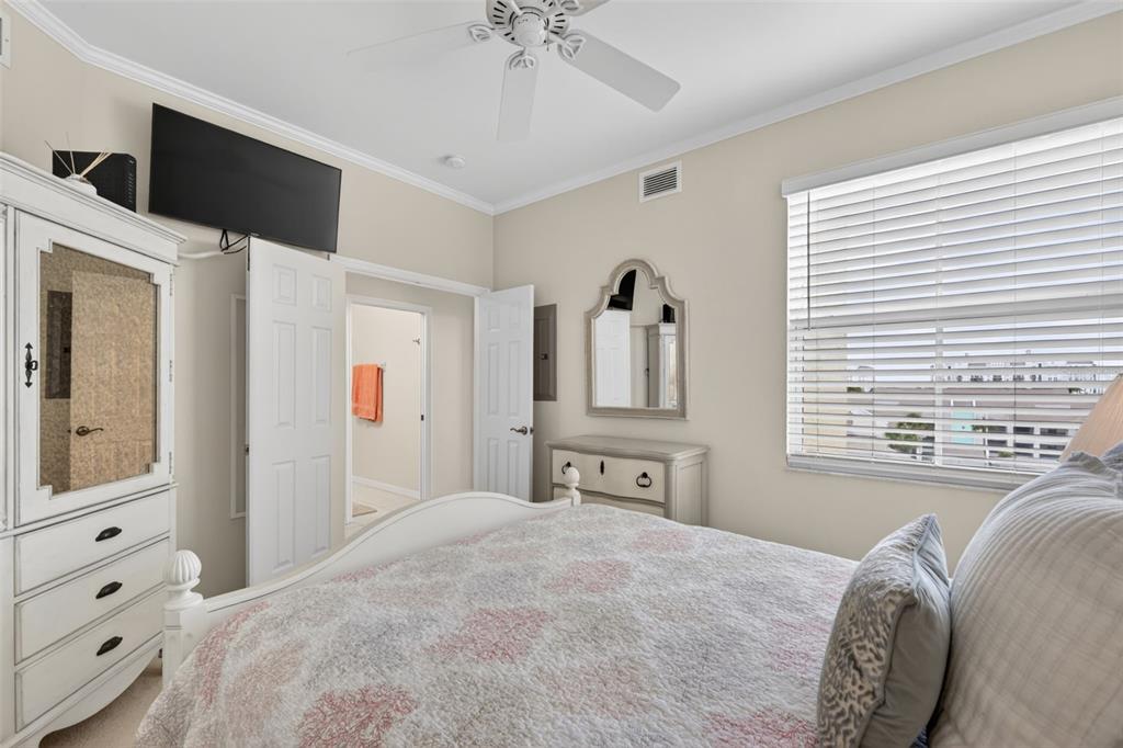 2060 Matecumbe Key Road, Unit 2506 Punta Gorda, FL 33955 - Photo 25 of 38 a bedroom with a bed and a chandelier