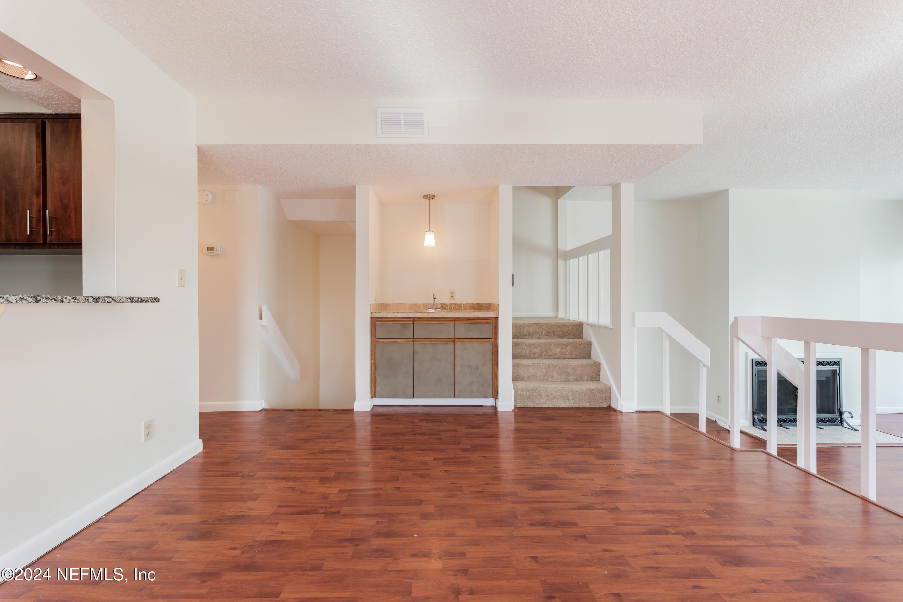 327 Scenic Point Lane Fleming Island, FL 32003 - Photo 15 of 54 a view of empty room with wooden floor