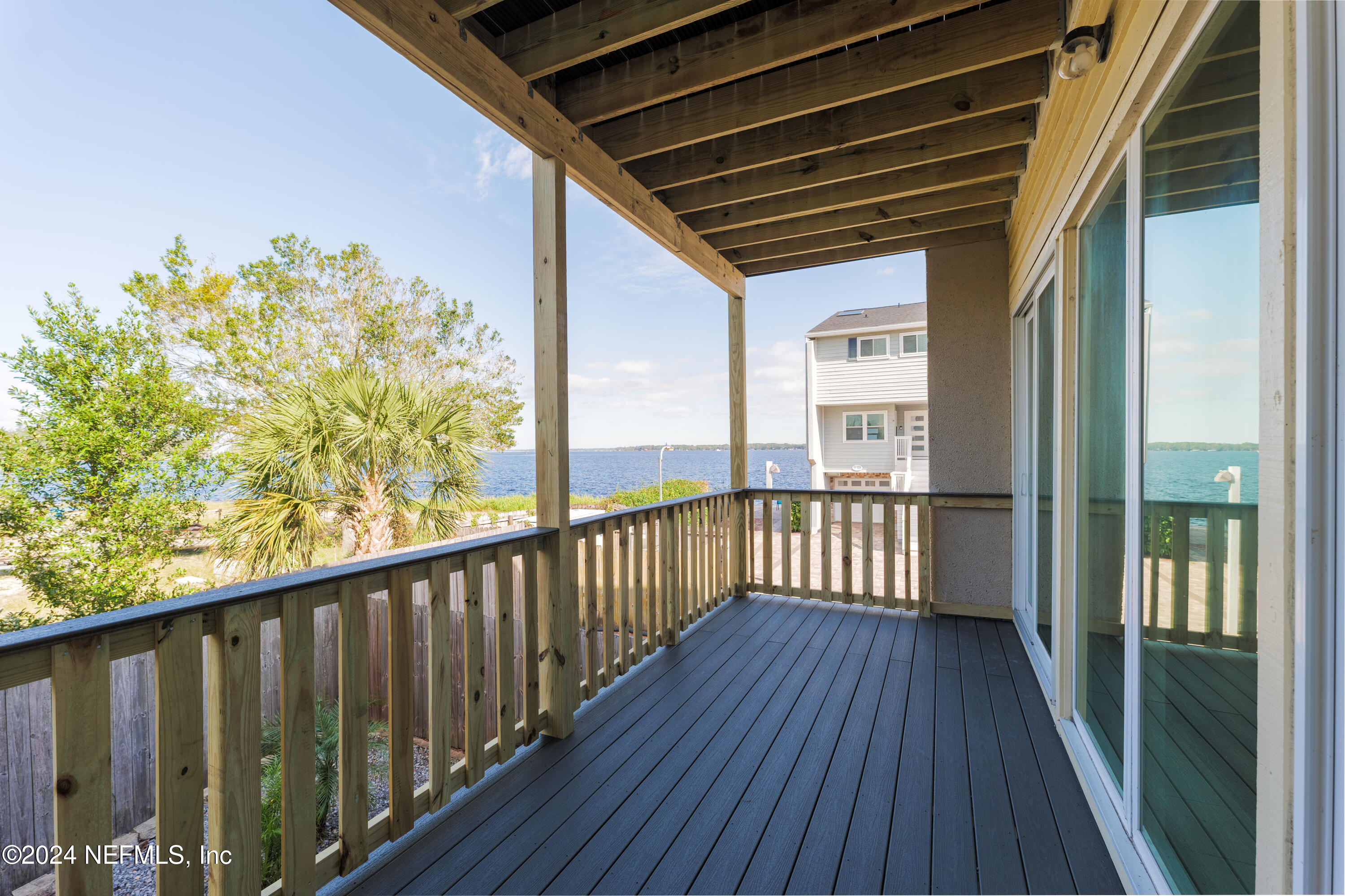 327 Scenic Point Lane Fleming Island, FL 32003 - Photo 19 of 54 a view of a balcony with wooden floor