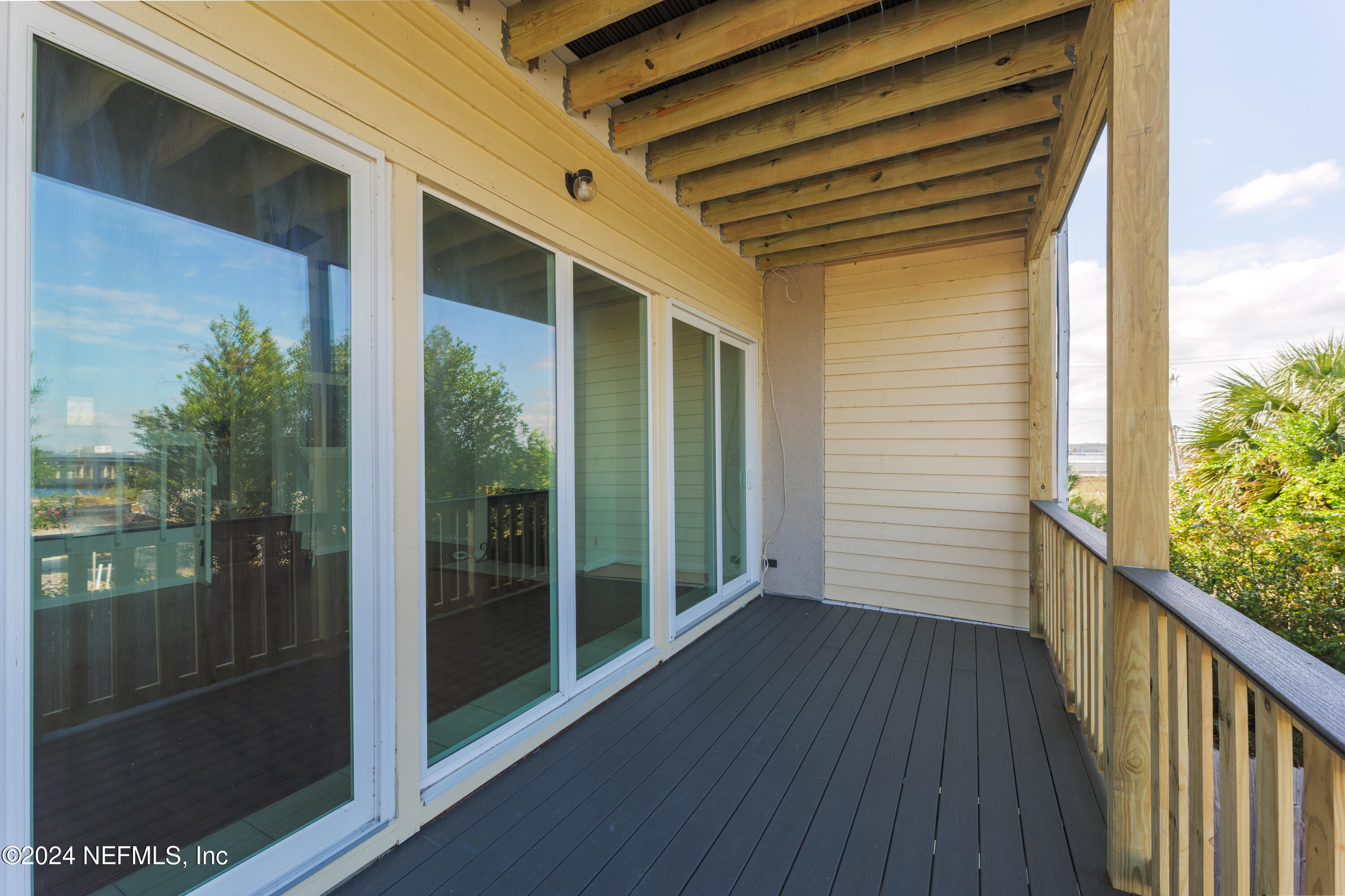 327 Scenic Point Lane Fleming Island, FL 32003 - Photo 20 of 54 a view of a porch with wooden floor and outdoor space